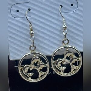 Brushed gold over silver trio jumping dolphins circle dangle earrings